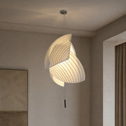 Pleated fabric pendant light installed in a room