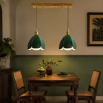 Cargar imagen en el visor de la Galería, Green linear leather pendant light over a dining table
