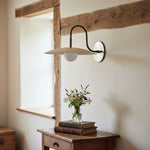 Load image into Gallery viewer, Curva Metal Modern Wall Sconce - Antique Brass Arm with Cream Disc Shade
