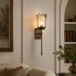 Cargar imagen en el visor de la Galería, Brass amber glass wall sconce in a living room corner
