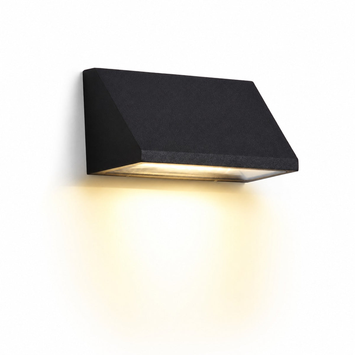Black wall light glowing on an exterior wall at night