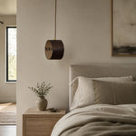 Cargar imagen en el visor de la Galería, Hand-laced leather cylinder pendant light in an interior setting