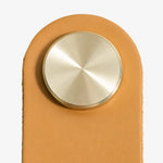 Afbeelding laden in galerijweergave, Cowhide leather and brass cabinet pull handle detail and lifestyle image