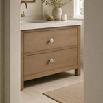 Bild in die Galerieansicht laden, Titanium silver knobs on a natural wood vanity