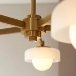 Bild in der Galerieansicht laden, Zirvos Pendelleuchte mit mattierten Opalgloben und gebürstetem Messingrahmen für Wohn- und Esszimmer