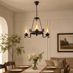 Afbeelding laden in galerijweergave, Three-light hurricane glass chandelier above a warm dining table