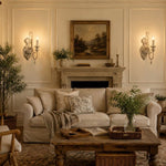 Carica l'immagine nella visualizzazione Galleria, Two-light wall sconces installed beside a traditional living room fireplace