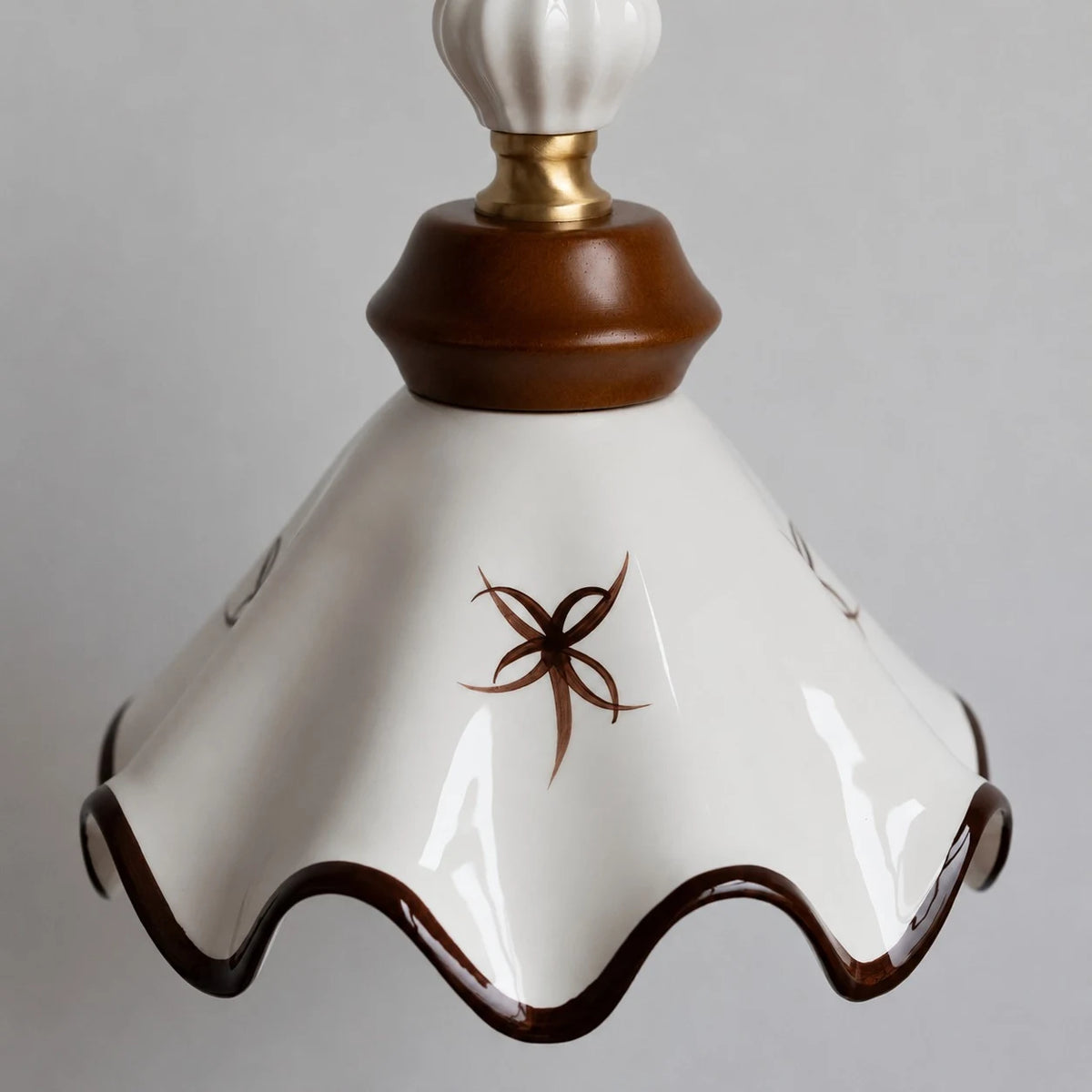 hand-painted scalloped ceramic shade detail