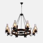 Afbeelding laden in galerijweergave, Eight-light wagon wheel chandelier with clear hurricane glass shades
