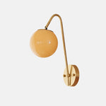 Cargar imagen en el visor de la Galería, French brass wall light with amber glass globe shade