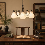 Afbeelding laden in galerijweergave, Vintage chandelier above a study desk with ribbed glass shades
