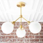 Load image into Gallery viewer, Glorica Glass Chandelier - Brass Globe Ceiling Light with Opal Shade

