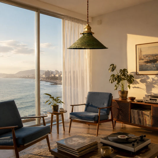 Distressed green pendant lamp installed in a warm living room by large windows