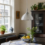 Cargar imagen en el visor de la Galería, Clear ribbed glass pendant light above a table with plants
