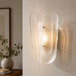 Afbeelding laden in galerijweergave, Clear glass wall sconce installed in a styled interior
