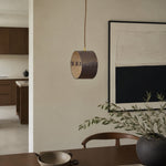 Cargar imagen en el visor de la Galería, Hand-laced leather cylinder pendant light in an interior setting