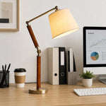 Charger l'image dans la visionneuse de la galerie, Solid wood table lamp illuminating a neat home office desk
