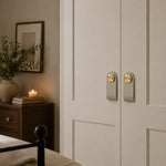 Afbeelding laden in galerijweergave, Cowhide leather and brass cabinet pull handle detail and lifestyle image