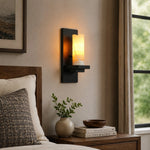 Cargar imagen en el visor de la Galería, Black metal wall sconce beside a bedroom nightstand