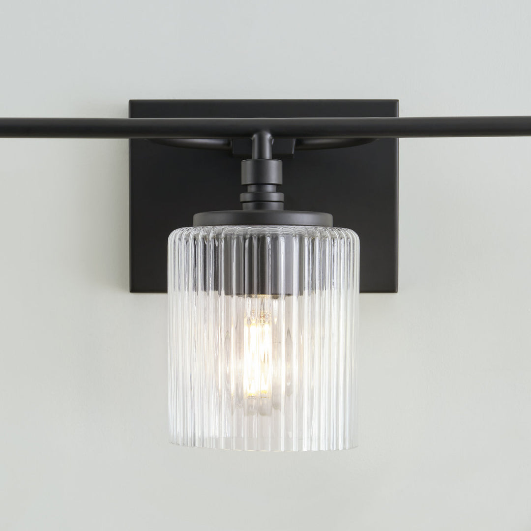 Luz de tocador Lirra de 3 luces regulable de vidrio y metal - Diseño moderno para baño y dormitorio