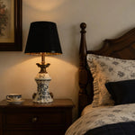 Afbeelding laden in galerijweergave, Blue porcelain motif table lamp beside a wooden bed