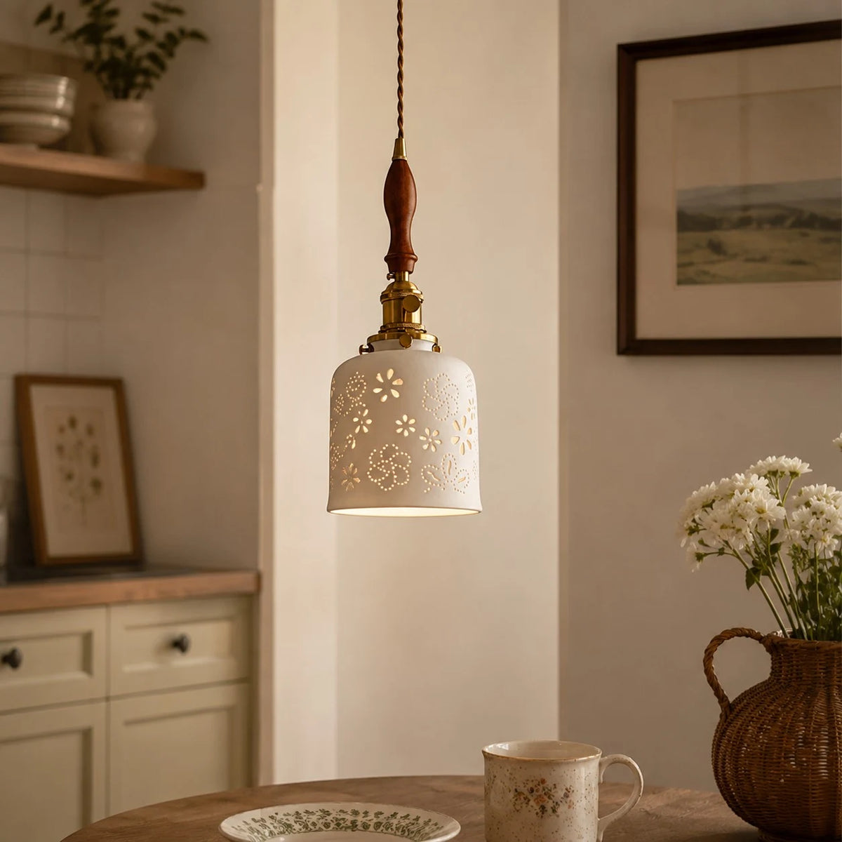 Wood accent floral ceramic pendant light above a table
