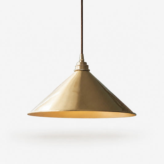 Bell shade copper pendant light on a white background