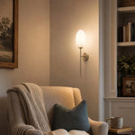 Cargar imagen en el visor de la Galería, Milk glass wall sconce in a reading corner