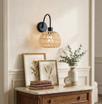 Cargar imagen en el visor de la Galería, Woven rattan wall sconce above a styled console