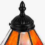 Cargar imagen en el visor de la Galería, Close view of black metal finial and ribbed frame on the stained glass shade