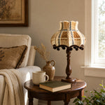 Cargar imagen en el visor de la Galería, Vintage fabric table lamp on a round side table by a window