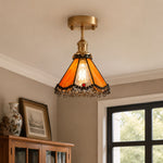 Cargar imagen en el visor de la Galería, Orange stained glass ceiling light above a cabinet corner