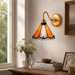 Cargar imagen en el visor de la Galería, Orange stained glass wall sconce above a window console