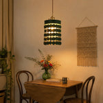 Afbeelding laden in galerijweergave, Green leather pendant light above a small dining table