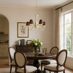 Load image into Gallery viewer, French chandelier centered above a round dining table in a neutral interior