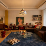 Cargar imagen en el visor de la Galería, Blue and white ceramic pendant lamp glowing in a warm living room