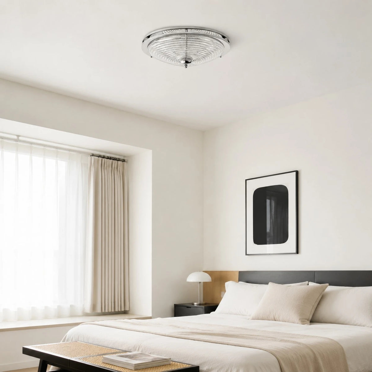 Chrome rippled glass ceiling light installed in a calm bedroom