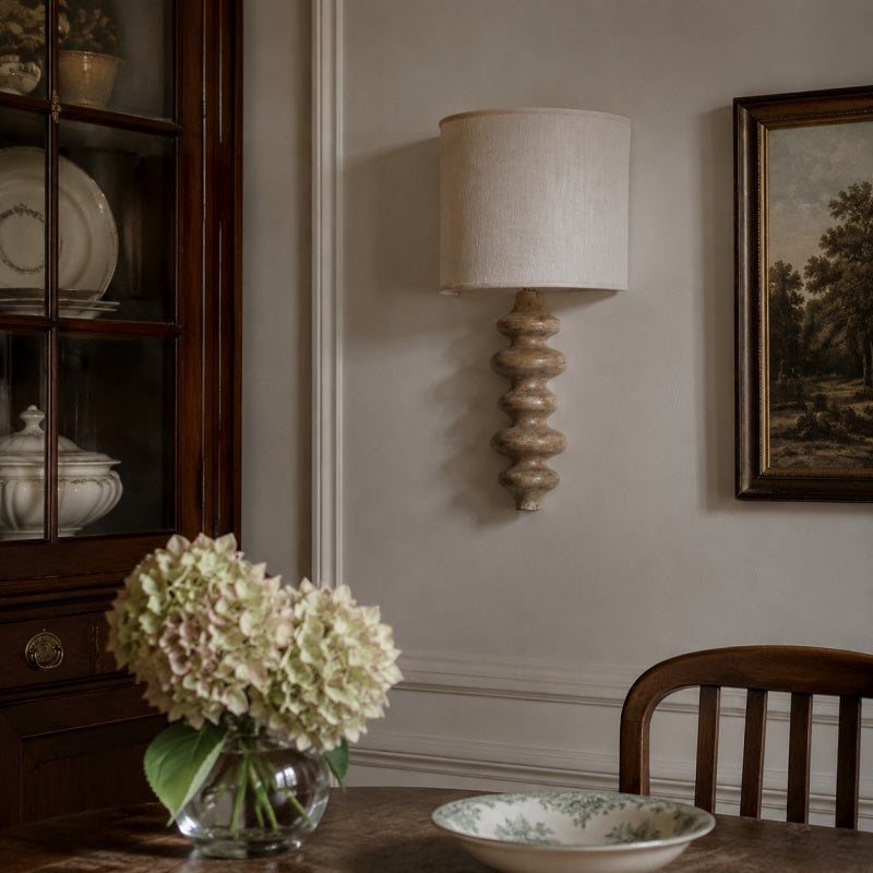 Natural wood wall lamp in a dining room setting