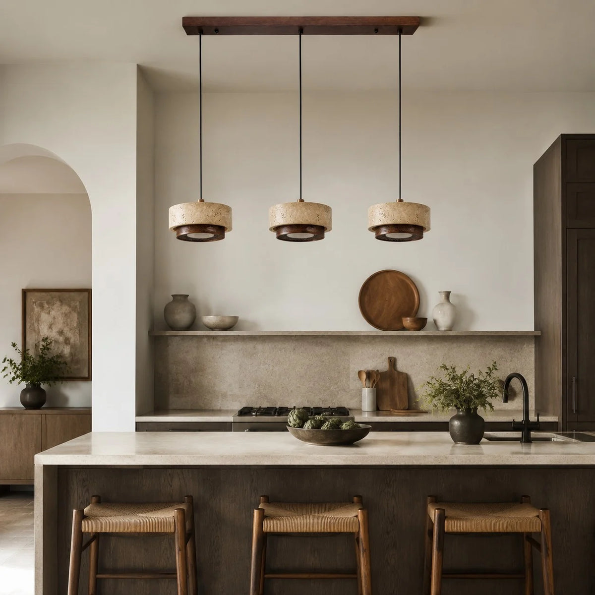 three head travertine pendant light over a kitchen island