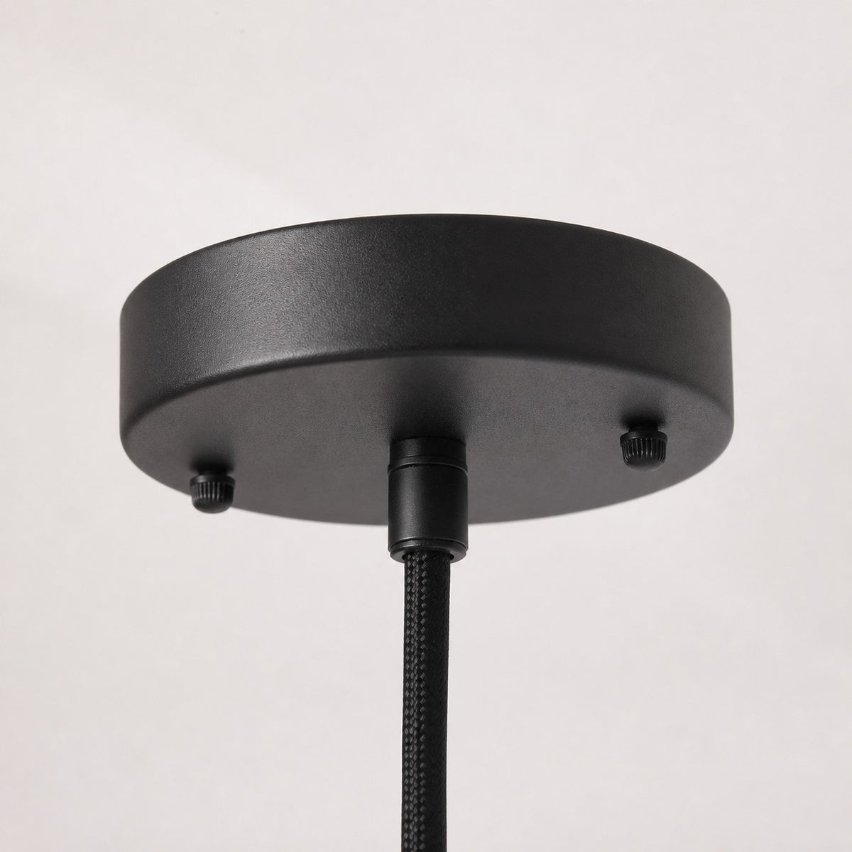 Black ceiling canopy detail for wooden pendant light