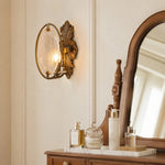 Cargar imagen en el visor de la Galería, Antique brass textured glass wall sconce installed beside a vanity mirror