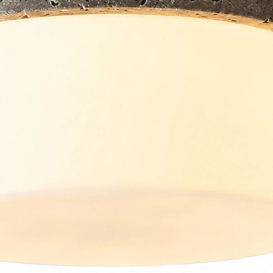 Close detail of warm glass shade and soft diffuser glow