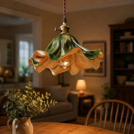 Dark green leather pendant light above a dining table