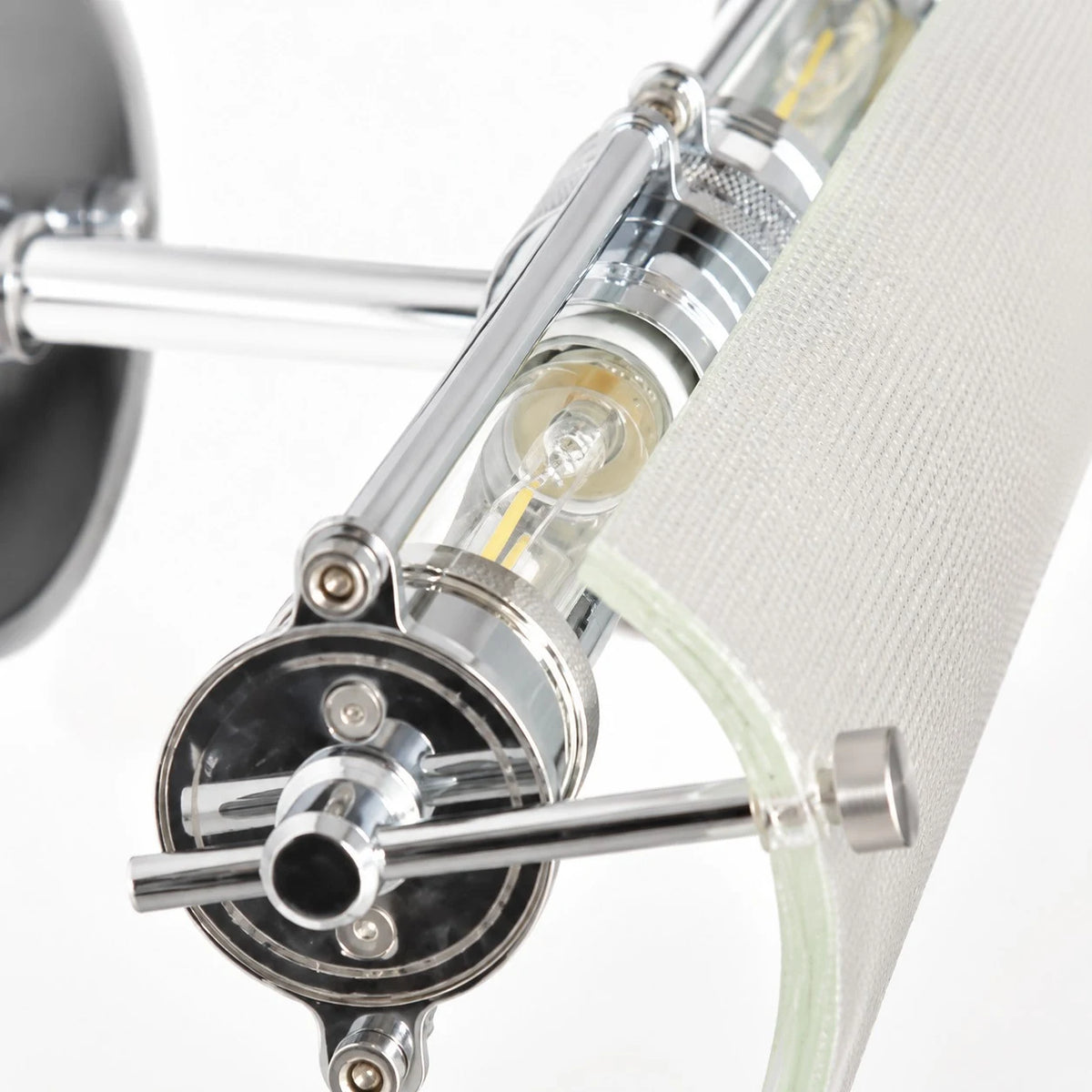 Close detail of the ribbed glass shade and metal bracket