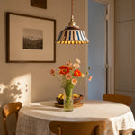 Cargar imagen en el visor de la Galería, Striped ceramic pendant lamp above a round dining table with flowers