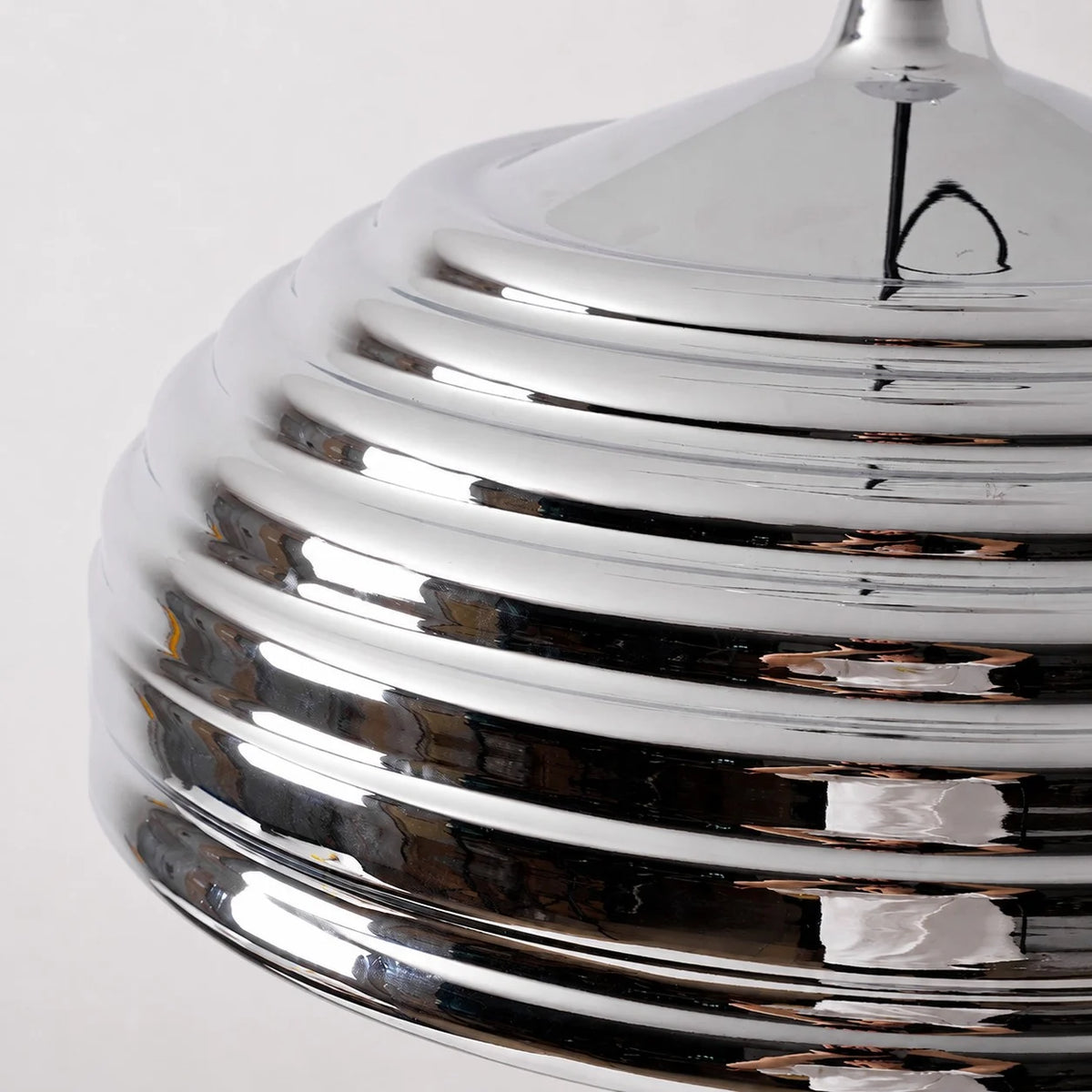Close view of the ribbed polished chrome dome shade