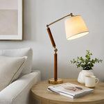 Charger l'image dans la visionneuse de la galerie, Warm fabric shade table lamp on a living room side table