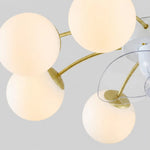 Carica l'immagine nella visualizzazione Galleria, Close-up of white glass globes and gold-toned arms