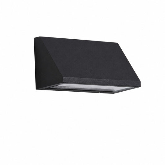 Black outdoor wall light installed on a courtyard wall