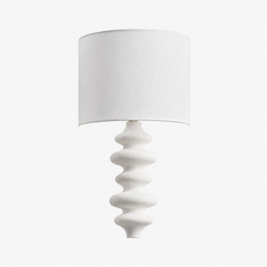 White sculptural wall lamp with white fabric shade